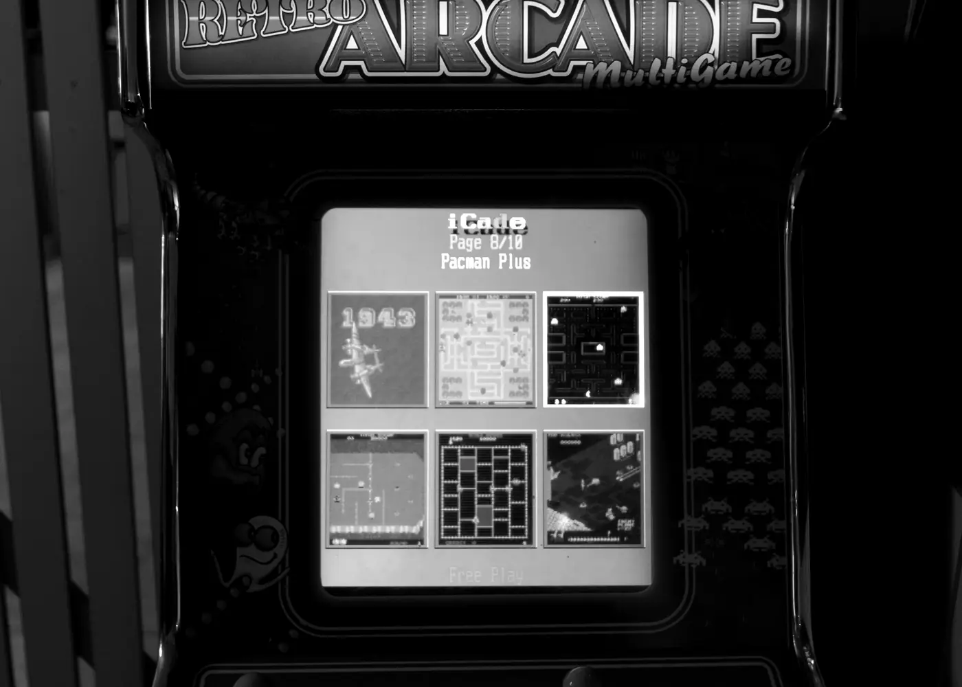 A lone arcade cabinet glowing in a dark room