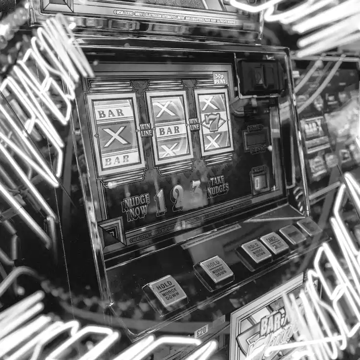 A single game machine standing in a dark room